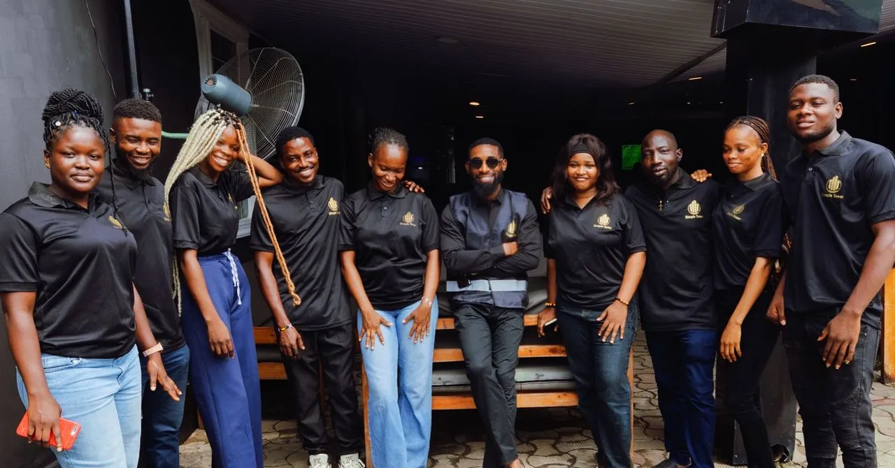 The Dimple Tower team in branded polos at the Lagos office